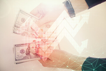 Multi exposure of arrows drawing hologram and USA dollars bills and man hands. Growth concept.