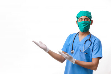 Young indian doctor in uniform showing direction with hand.