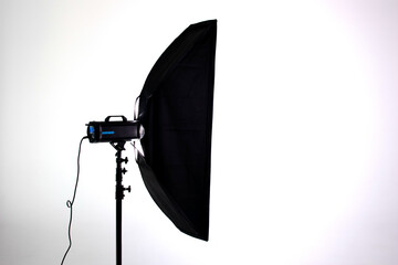 Professional photo studio strobe light with stripbox modifier isolated on white background - obrazy, fototapety, plakaty
