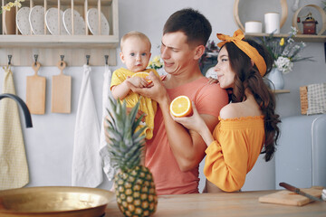 Beautiful family prepare food in a kitchen