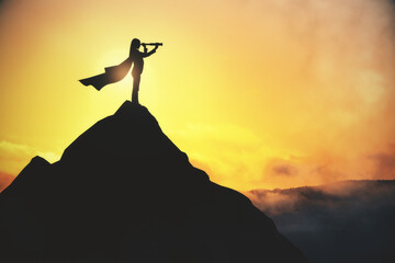Businesswoman with telescope standing on creative backlit mountain and sunset background with mock up place for your advertisement. Leadership and tomorrow concept. - obrazy, fototapety, plakaty