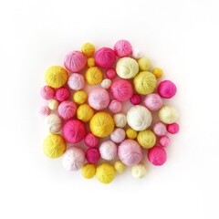 Fototapeta na wymiar Color yarn for knitting. Yellow and pink balls of yarn.