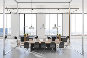 Stylish sunny meeting room with glass walls, modern wooden conference table and black chairs around in light interior design office with stylish lamps from top and city view from huge windows