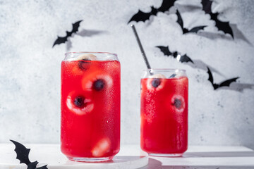 Red halloween cocktail with lychee and blueberry eyeballs