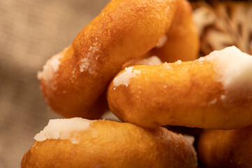 Fresh homemade doughnuts with powdered sugar. Close-up Selective focus.