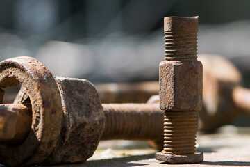 old rusty bolt, iron rod with screw threads. Rusted mechanical components. threaded bolt and nut. dismantling concept, difficult to unscrew, non-removable. selective focus, close-up, macro - obrazy, fototapety, plakaty