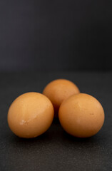 Group of uncooked brown eggs
