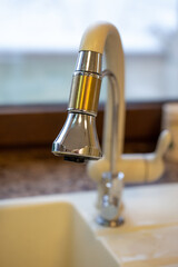 faucet in the sink in the kitchen close-up