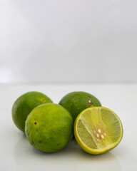 Group of fresh limes on white background