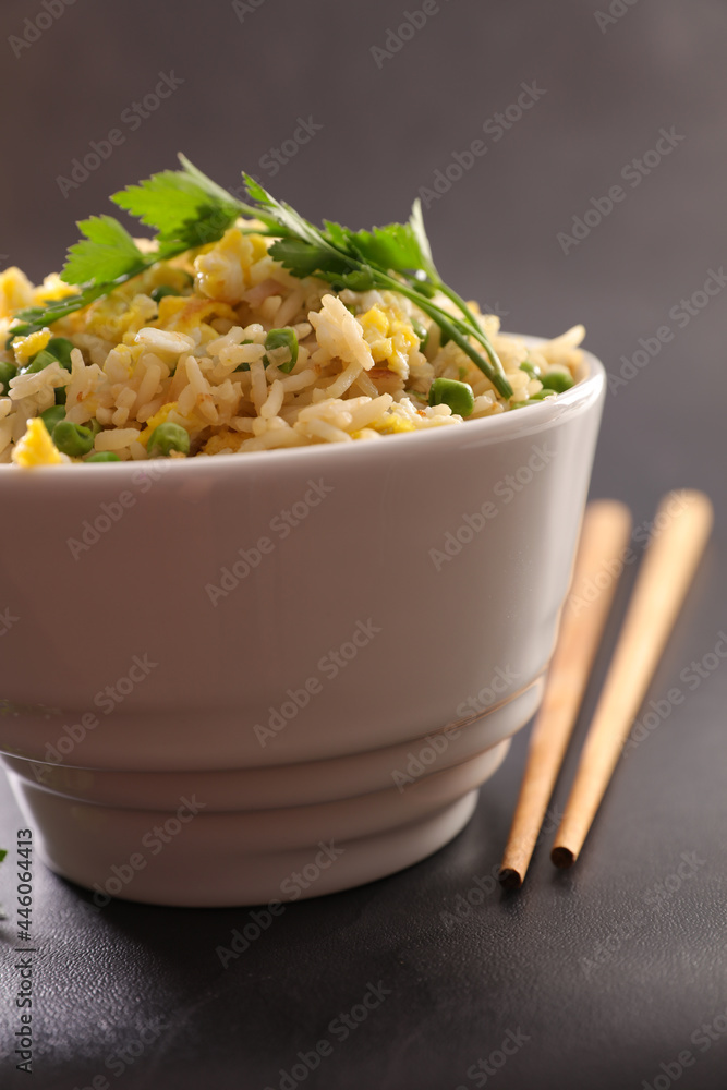 Poster bowl of fried vegetable and chopsticks