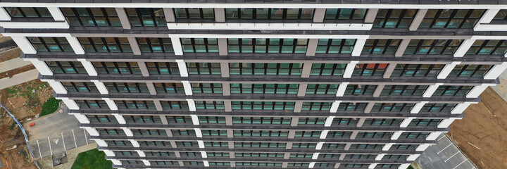 Beautiful multi-storey building standing on construction site top view