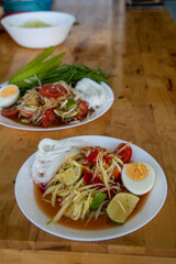 Thai spicy green papaya salad Som Tam Thai and Som Tam Korat