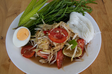 Thai spicy green papaya salad Som Tam Korat