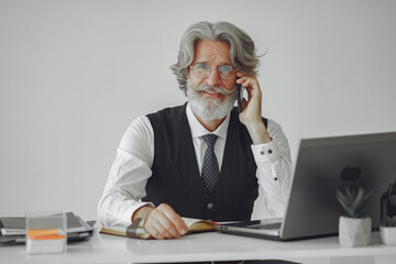 Fototapeta premium Handsome pensive mature businessman in the office
