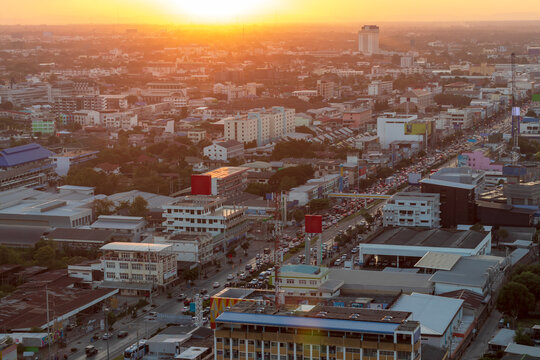 A high angle view of a capital city with the orange sunset.