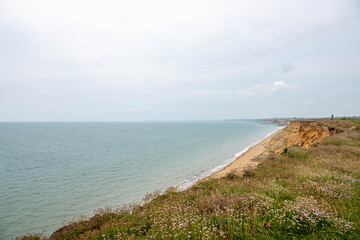 view of a deserted English beach from the cliff tops