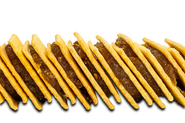 Side view stack of pineapple cheese shake biscuit isolated on white background.
