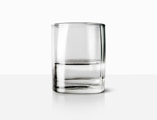 Glass with water on a light background.