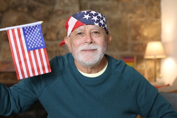 American senior man holding the USA flag