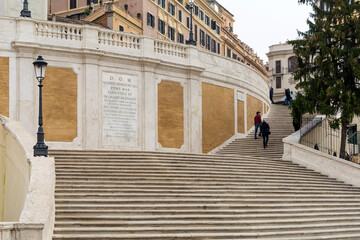 The Spanish Steps, a set of steps climbing a steep slope between the Piazza di Spagna at the base...