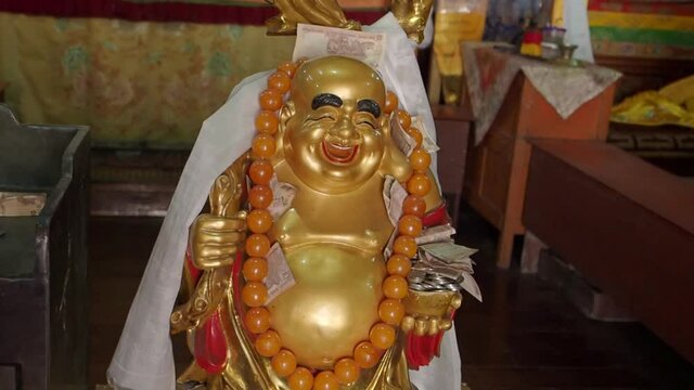 A laughing Buddha statue at Darjeeling Monastery