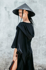 Beauty samurai woman posing in the street, black color style, fashion model, asian girl, kimono