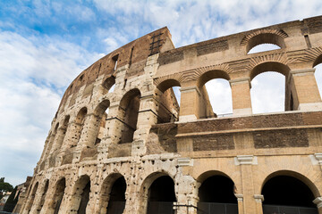 Obraz premium Colosseum, Rome, Italy. Colosseum, originally known as the Flavian Amphitheater, commissioned in A.D. 70-72 by Emperor Vespasian, is the largest amphitheater ever built, made of concrete and sand.