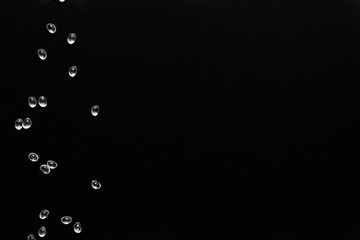 white granules of rubber and polypropylene on a black background. Plastics and polymers industry.