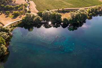 Fototapeta na wymiar Lake Capodacqua, aerial view, reflections, clarity, water transparency, flight, ancient remains, underwater, fly, landscape, drone, image, photo