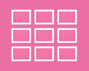 White wooden empty picture frames on bright pink background with copy and product mockup space