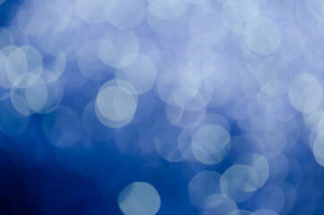 abstract blue bokeh glitter sparkle background.