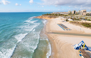 Aerial drone point of view empty beach of Mil Palmeras. Spain