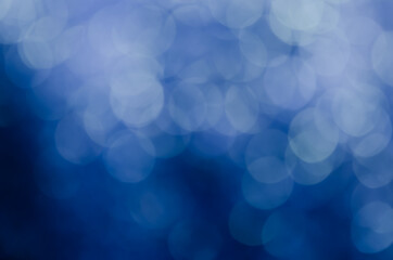 abstract blue bokeh glitter sparkle background.