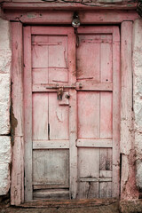 old vintage wooden door on retro wall, Wafgaon, India.