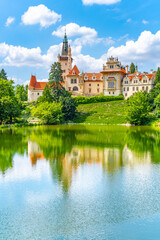 Pruhonice castle and natural park landscape with garden lake on sunny summer day, Pruhenice, Czech Republic. UNESCO World Heritage Site