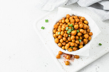 Healthy snack, spicy turmeric chickpea in a bowl. Space for text, top view.
