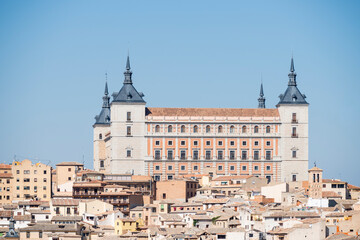 Fototapeta na wymiar panoramic view of the Alcazar of Toledo and part of the surrounding houses one sunny and torrid afternoon in Castilian summer