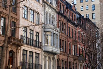 Fototapeta na wymiar Row of Colorful Old Brownstone Homes and Residential Buildings on the Upper East Side of New York City