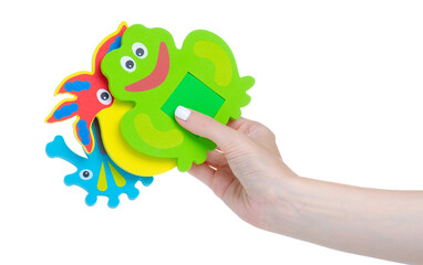 Baby bath toys in hand on white background isolation
