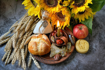 Ritual harvest altar for Lammas, Lughnasadh pagan holiday. wheel of the year with ears of wheat,...