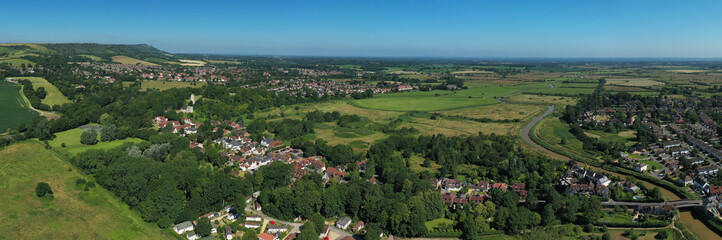 Bramber Castle and St Nicholas church overlooking the English village of Bramber in Sothern England. Aerial panoramic photo..
