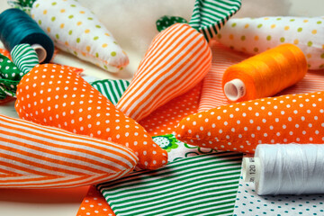Fabric carrot from multicolor fabric. Craft for children. Easter decoration, gift.