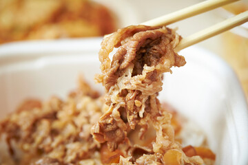 pick up beef bulgogi with chopsticks