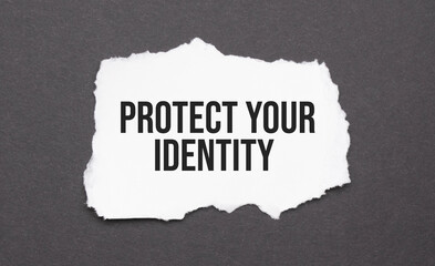 Protect Your Identity sign on the torn paper on the black background