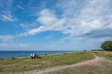 Unrecognizable people enjoy the northwest coast of Swedish Baltic Sea island Oland. The island is a popular tourist destination known as the island of sun and wind.