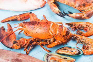Seafood dinner, seafood dinner with fresh lobster, crab, mussel and oyster as background