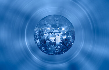 Fototapeta na wymiar Party disco mirror ball reflecting blue lights
