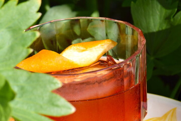 Red Negroni inspired cocktail with Orange wedge garnish