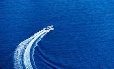 Greece. View of the speedboat and the blue sea water. Rest and travel. Summer landscape from the...