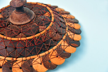 Basket Cover,hand made from coconut shell in brown color isolated on color background,concept of hand made product and earth friendly